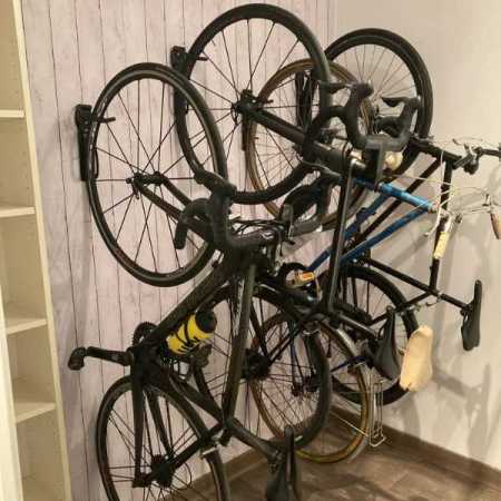 bikes-hanging-on-the-wall-on-bike-hanger-side-view