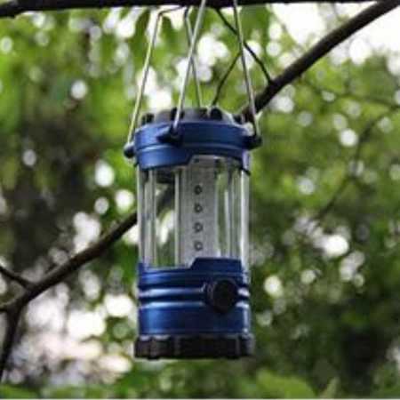 Camping-Lantern-Hanging-from-a-Tree
