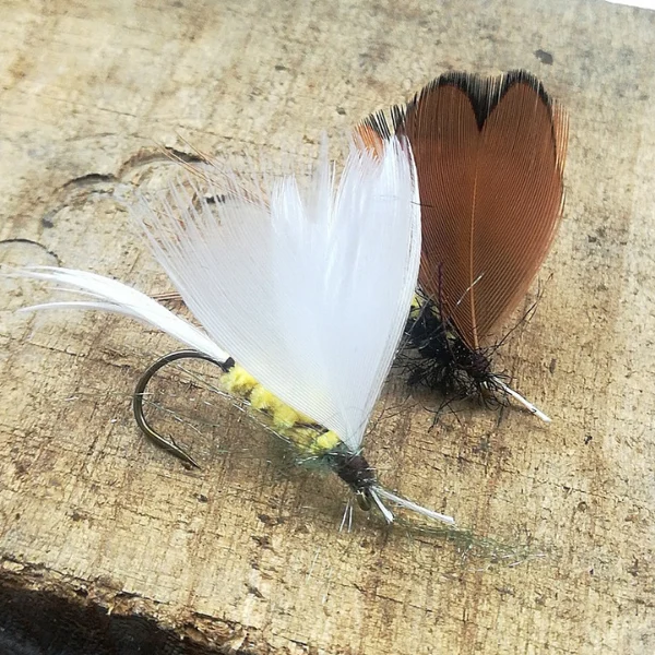 White-and-brown-fishing-flies.webp