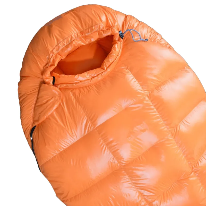 orange-sleeping-bag-with-square-baffles-top-close-up.webp