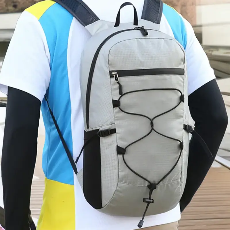 small-grey-backpack-on-the-back-of-someone.webp