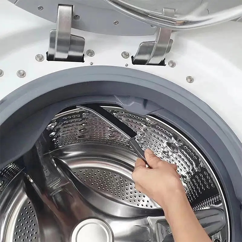 cleaning-washing-machine-with-a-crevice-cleaning-tool.webp