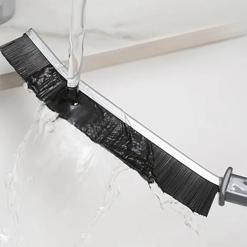 rinsing-crevice-cleaning-tool-under-a-tap.webp