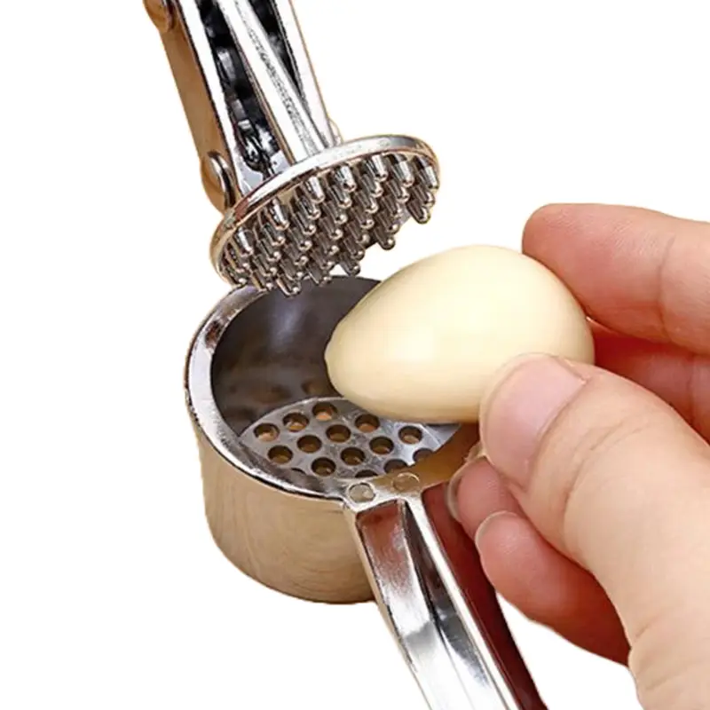 putting-a-garlic-cove-in-the-garlic-crusher-to-have-it-crushed.webp